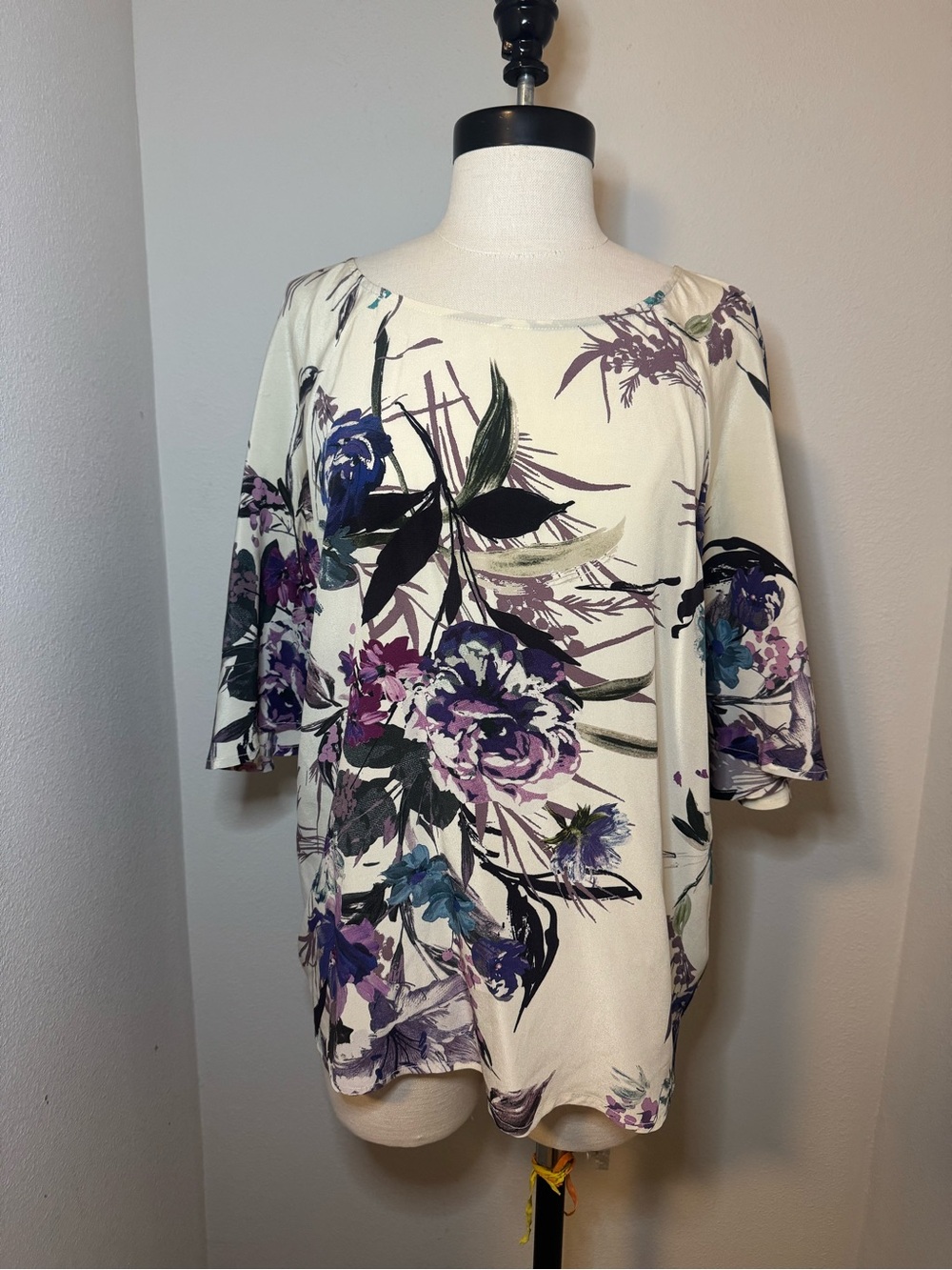Maeve blouse features a vibrant watercolor floral print